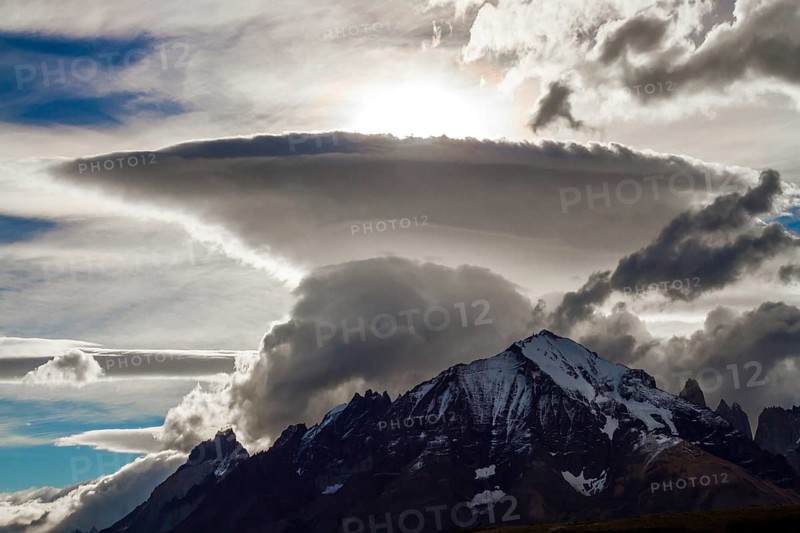 Incredible clouds of the Southern Hemisphere. Patagonia. The magnificent park of Torres del Paine. South America. The concept of extreme tourism and photo tourism