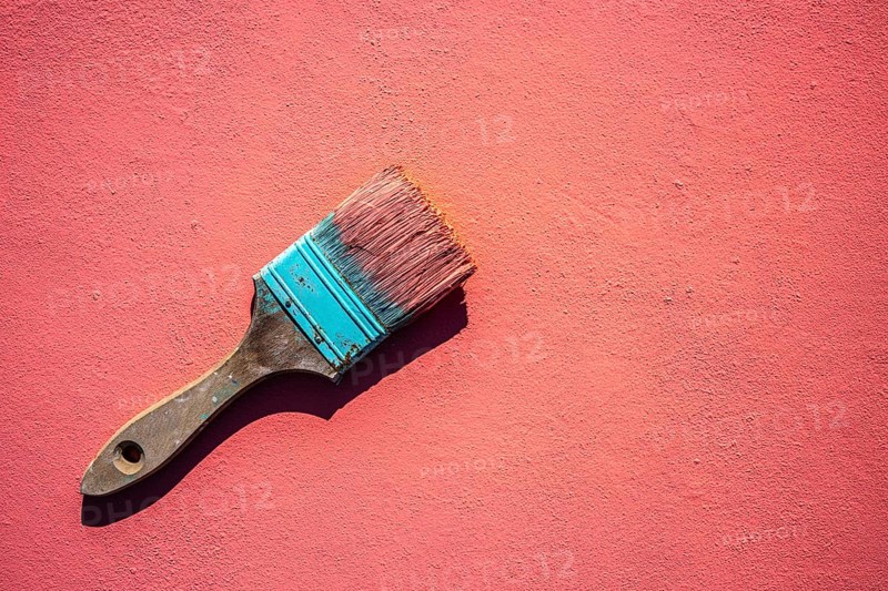 Coral color grunge brush with paint in monochromatic coral background wall