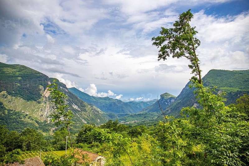 Coastal landscape shot. View from a road leading through a mountainous landscape and breathtaking green Mediterranean scenery. Coast near Salerno, Italy, Europe
