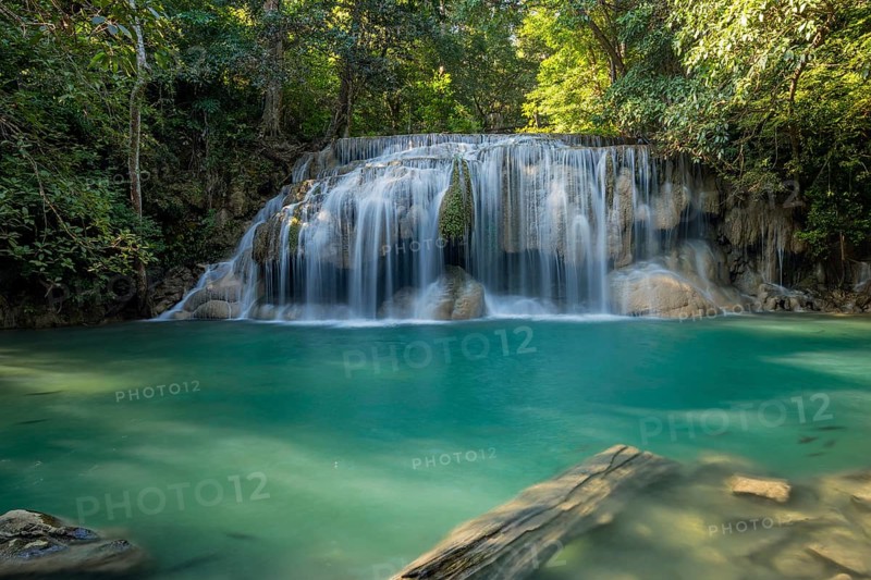 Erawan Waterfall with fish in water in Kanchanaburi Province, Thailand, Asia
