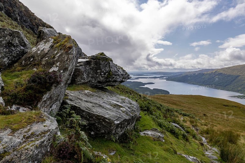 Rocks at the summit and views of Loch Lomond and the Loch Lomond and the Trossachs National Park area, Ben Lomond, Rowardennan, Scotland, United Kingdom, Europe
