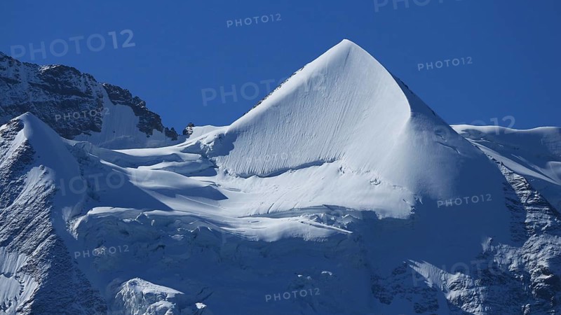 Snow covered pointed peak of Mount Silberhorn, Switzerland, Europe