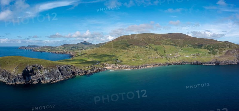 Landscape view of the turquoise waters and golden sand beach at Slea Head on the Dingle Peninsula of County Kerry in western Ireland
