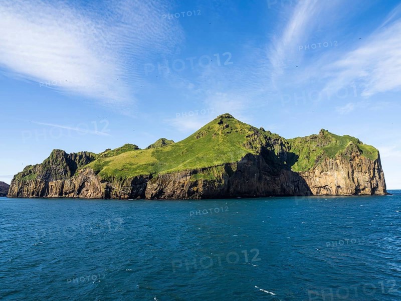 Steep cliffs in the blue sea, Westman Islands, Iceland, Europe