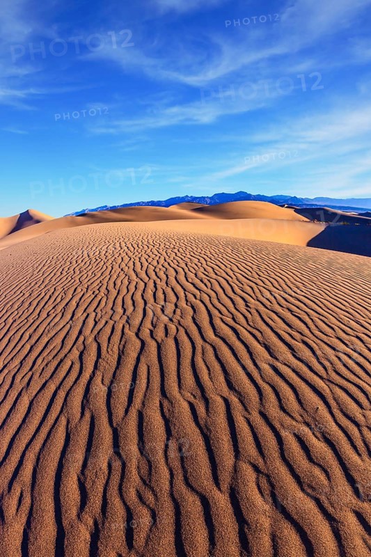 Mesquite Flat Sand Dunes. Bright solar morning in picturesque part of Death Valley. Thin waves on sand