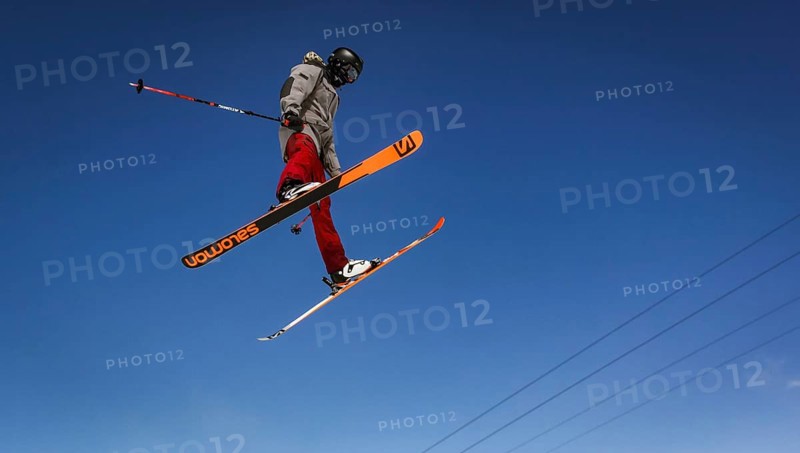 Skier jumping on a snow park in Austrian alps