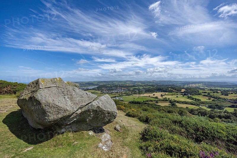 Large rock on a hill with sweeping views over a green landscape around Conwy and Conwy Castle on the edge of Snowdonia National Park, Conwy, Dwygyfylchi, Caernarfonshire, Conwy County Borough, Wales, United Kingdom, Europe
