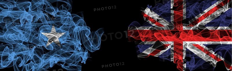 Flags of Somalia and United Kingdom on Black background, Somalia vs United Kingdom Smoke Flags