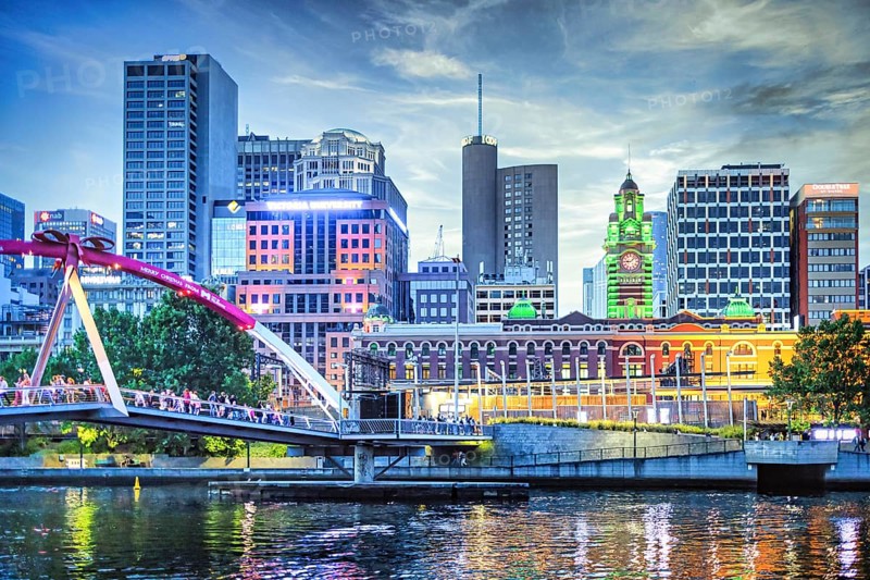 Evening atmosphere in Melbourne on the Yarra River with the Evan Walker Bridge and Flinders Street railway station in Victoria