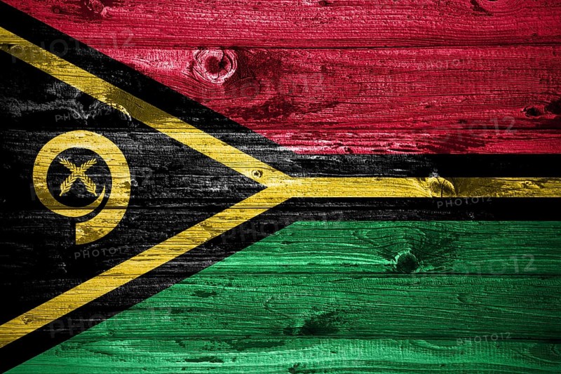Vanuatu flag on wooden planks background wood flag