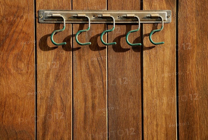 Rural hanger over wooden wall, horse stables