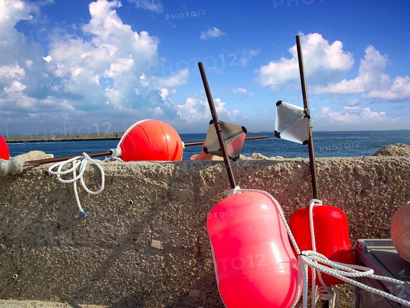 Longliner fisherboat buoy tackle in formentera blue sky
