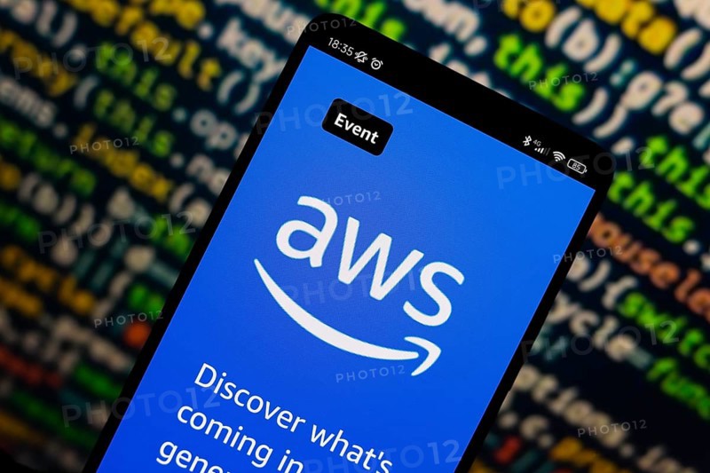 In this photo illustration, the Amazon Web Services (AWS) logo is displayed on the website on the smartphone screen