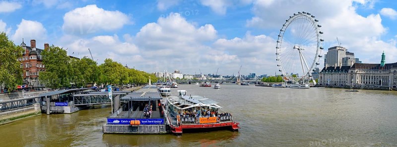 Panorama of Westminster Millennium Pier on the north bank of the River Thames with London Eye at background in London, United Kingdom, Europe