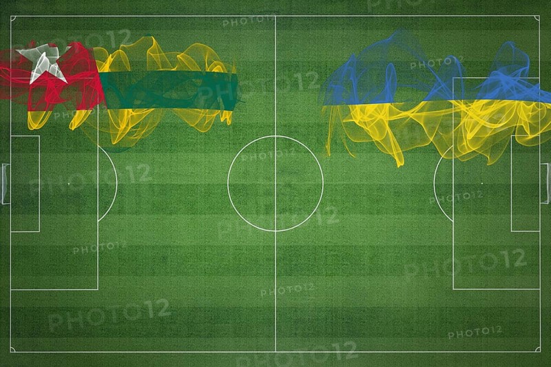 Togo vs Ukraine Soccer Match, national colors, national flags, soccer field, football game, Competition concept, Copy space