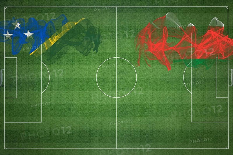 Solomon Islands vs Oman Soccer Match, national colors, national flags, soccer field, football game, Competition concept, Copy space
