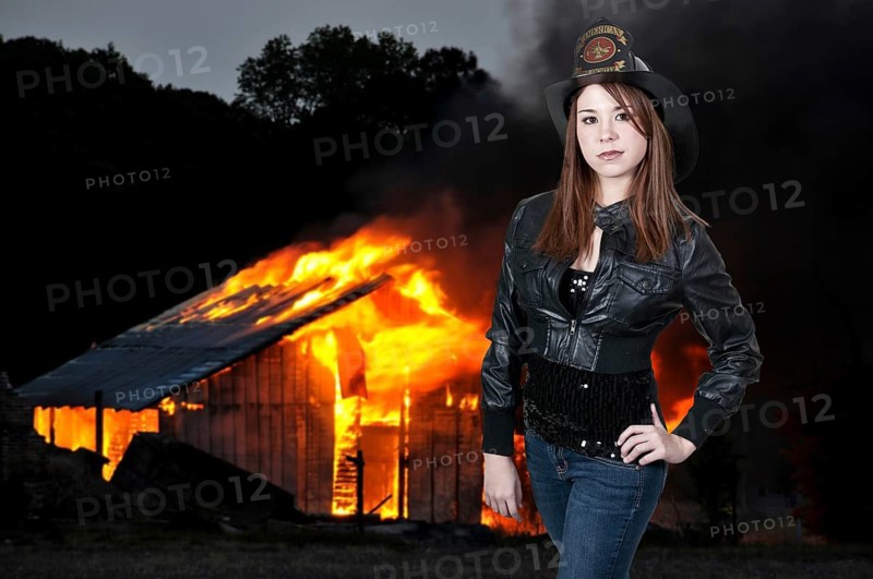 A beautiful woman firefighter at a fire