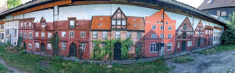 Panoramic photo of garage doors, with graffiti facades of buildings from the medieval old town of Lüneburg, Hanseatic city of Lüneburg, Lower Saxony, Germany, Europe