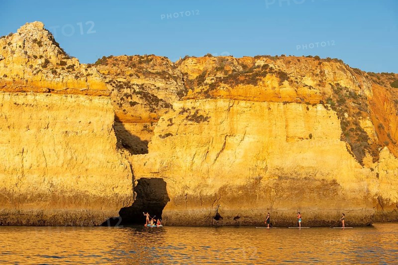 Stand-up paddler at Ponta de Piedade, Lagos, Algarve, Portugal, Europe