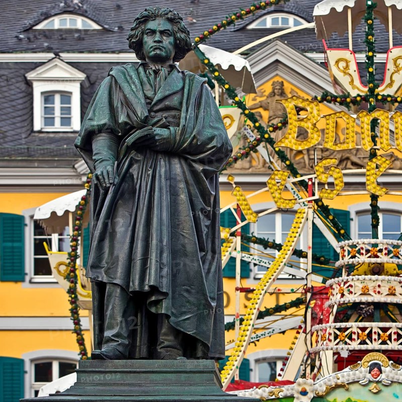 The Beethoven monument in front of the Bonn Christmas market Ferris wheel on Münsterplatz, Bonn, North Rhine-Westphalia, Germany