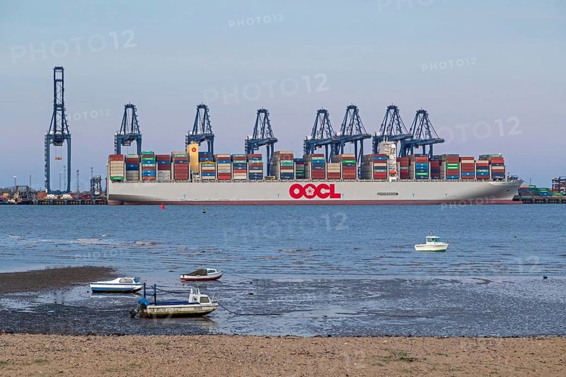 Container ship, container gantry cranes, boats, harbour, Harwich, Suffolk, England, Great Britain
