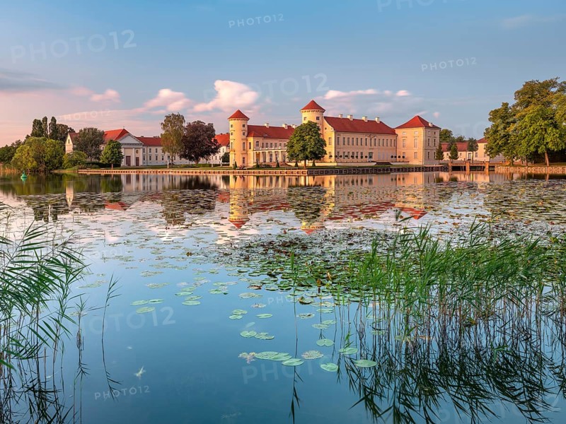 Rheinsberg Castle on Lake Lake Grienerick in the last evening light, Rheinsberg, Brandenburg, Germany