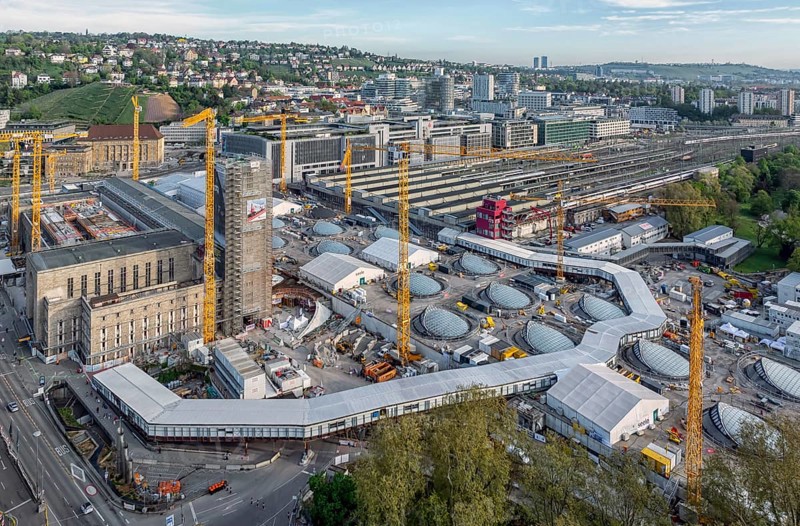 Stuttgart main station with Bonatzbau. Stuttgart 21 construction site with station tower and crane. Light eyes, windows on the roof of the new through station. Aerial view. Stuttgart, Baden-Württemberg, Germany