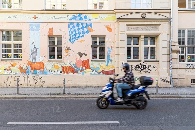 Colourful facade painting with motifs for children at the 15th primary school on Görlitzer Straße in Dresden, Saxony, Germany