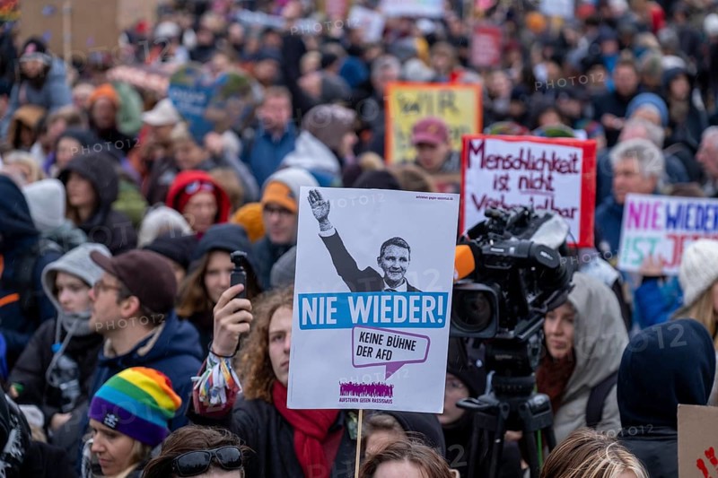 Germany, Berlin, 3 February 2024, Protest against the rise of right-wing extremism, called by the alliance Hand in Hand, Jetzt solidarisch aktiv werden! . Following a rally on the lawn in front of the Reichstag building, Never again, Höcke, AfD
