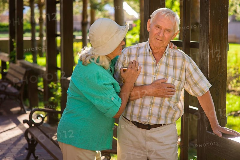 Senior man has heart ache. Elderly couple outside. I feel pains again. Husband has chronic illness