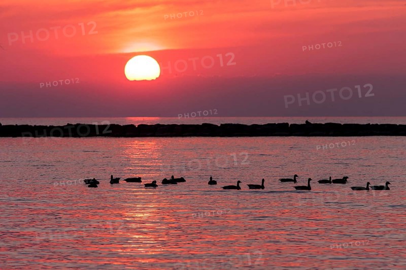 Sunset over Lake Huron as seen from the shoreline in Goderich, Ontario, Canada, North America