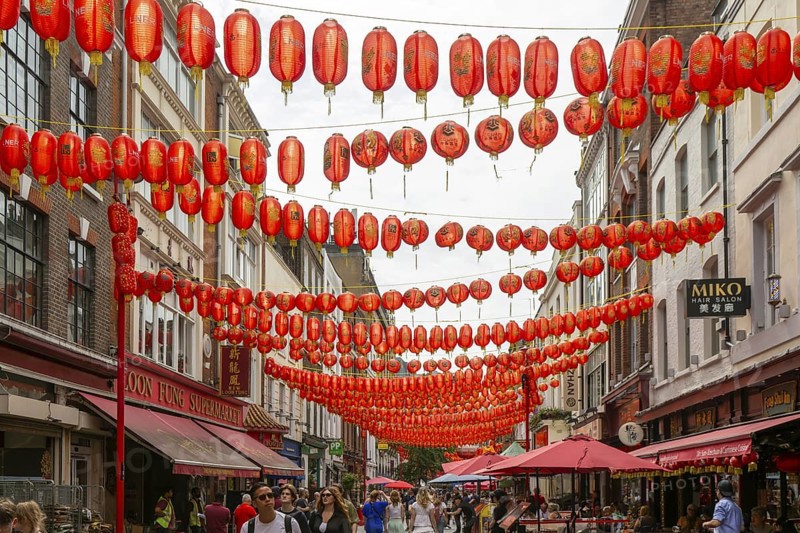 Red Chinese lanterns crossing above Gerrard Street, Chinatown, West End, London, England, UK