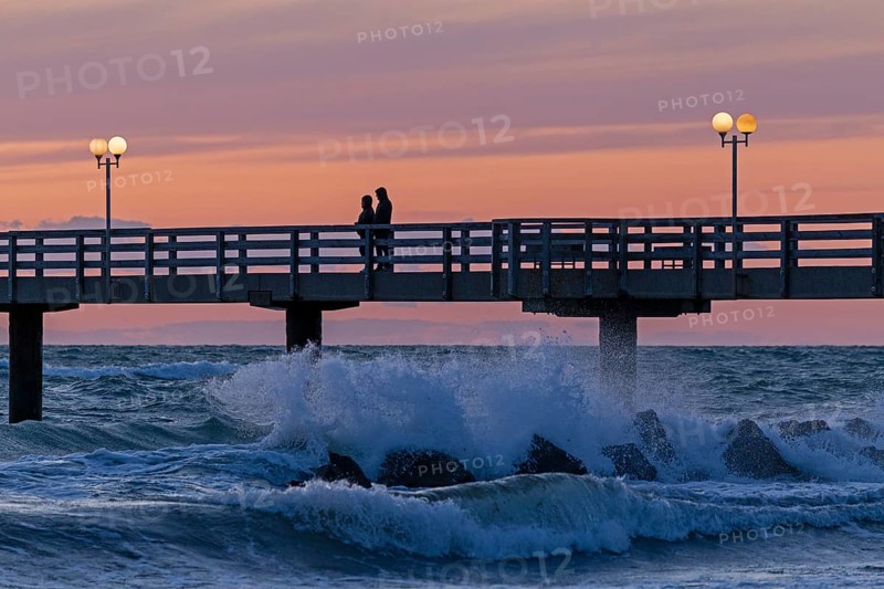 Sunset, pier, people, silhouettes, waves, swell, spray, street lamps, Wustrow, Fischland, Mecklenburg-Vorpommern, Germany