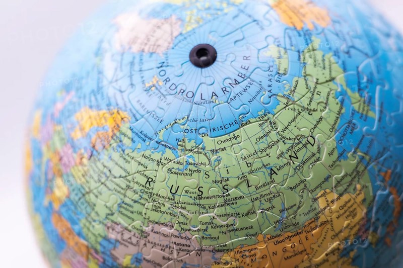 Puzzle globe. Map made from puzzle pieces. Russia and North Pole