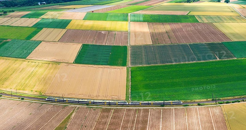 Agricultural area in the Neckarbogen near Lauffen am Neckar. Regional railway on the way. Lauffen am Neckar, Baden-Württemberg, Germany