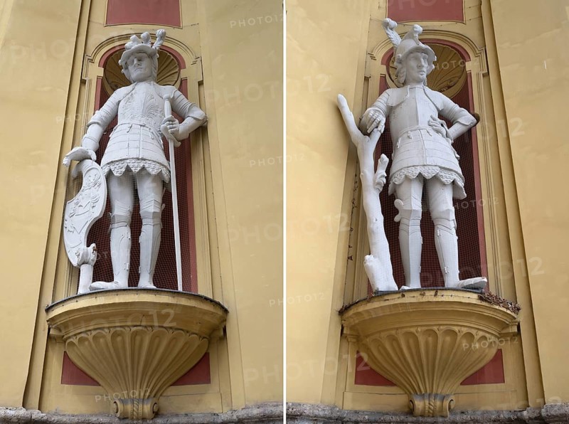 Two sculptures, the giant Haymon founder of the monastery and his opponent the giant Thyrsus, legendary figure at the entrance portal of Wilten Abbey, Klostergasse 7, Wilten, Innsbruck, Austria