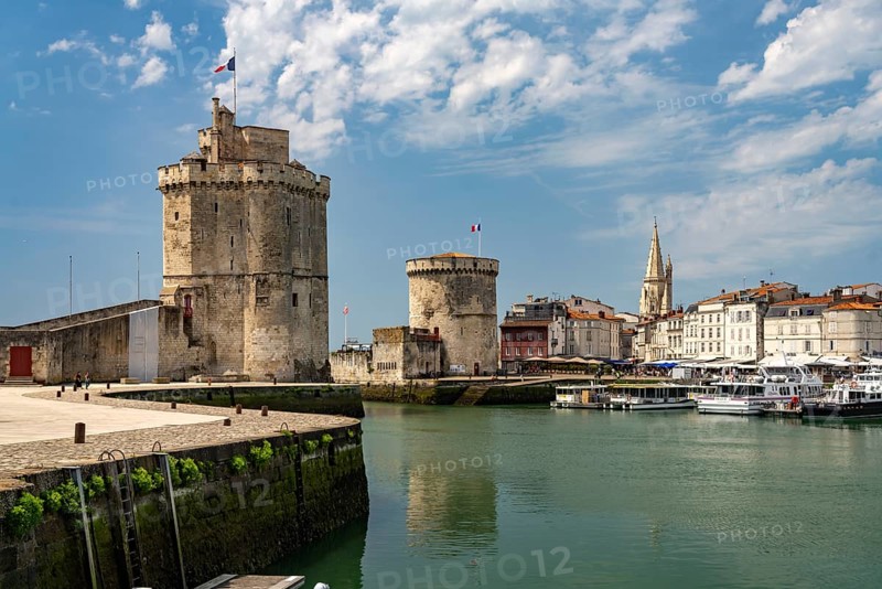 Harbour entrance to the old Vieux Port with the medieval towers Tour St.-Nicolas, Tour de la Lanterne and Tour de la Chaine, La Rochelle, France