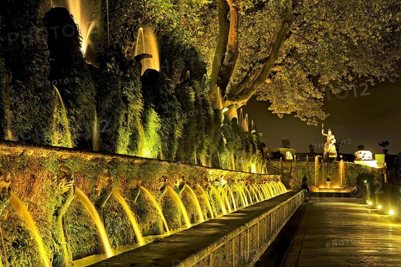 Avenue of a Hundred Fountains, Viale delle Cento Fontane, behind Fontana della Rometta, Renaissance garden of Villa d'Este, water features, fountains, atmospheric illumination at night, UNESCO World Heritage Site, Tivoli, metropolitan city of Rome, Lazio, Italy