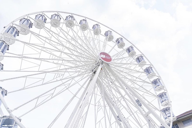 Beautiful Ferris wheel with illuminated gondolas in front of a clear sky, Ferris wheel construction, Calw, Germany