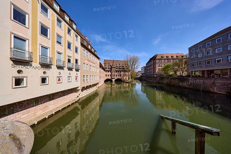 Heilig-Geist-Spital, Spital-Apotheke, historical buildings, river Pegnitz, facade, windows, trees, symmetrical reflections, water surface, blue sky, cirrostratus clouds, Pfarrgasse, Nuremberg, Middle Franconia, independent city, Bavaria, Germany