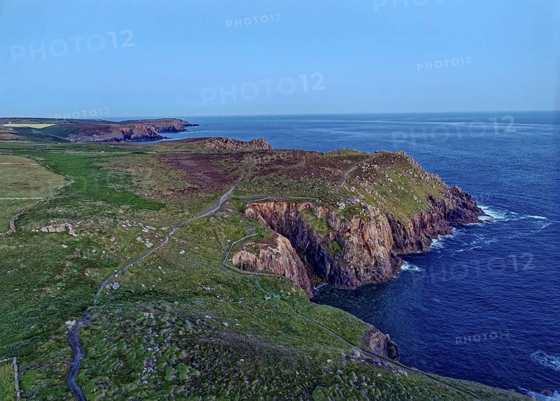Land's End, coast and landscape on the Atlantic, at dusk. Land's End, the tip of the headland in the west of Cornwall, is the most westerly point in England. Land's End, Sennen, Penzance, Cornwall, South West England, Great Britain