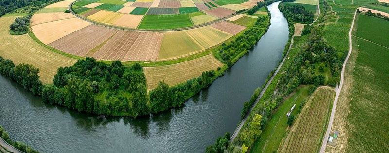 Agricultural area in the Neckarbogen near Lauffen am Neckar. Cereal fields in different shades of green. Neckar bend near Lauffen am Neckar, Baden-Württemberg, Germany
