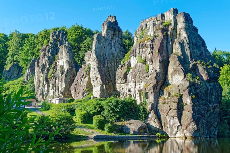 The Externsteine, a sandstone rock formation around 40 metres high in the Teutoburg Forest, are a natural landmark and a protected natural and cultural monument. They are regarded as a place of power and are said to have special cultural and historical significance. The rocks are located by the Wiembecketeich pond. Horn-Meinberg, North Rhine-Westphalia, Germany