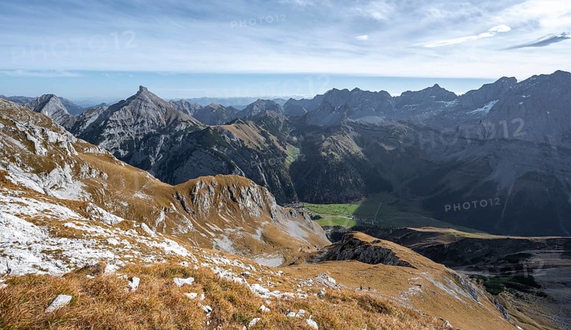 Picturesque mountain landscape in autumn, view of rocky mountain ridge, mountain peaks Lamsenspitze and Sonnjoch, Rißtal in the Eng, Karwendel, Tyrol, Austria