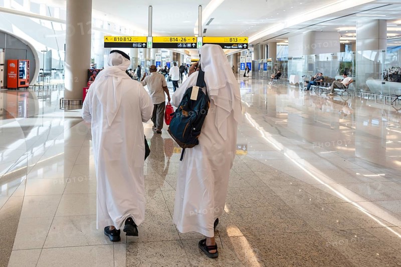 Airport Arab with traditional garment and headdress, Abu Dhabi, United Arab Emirates