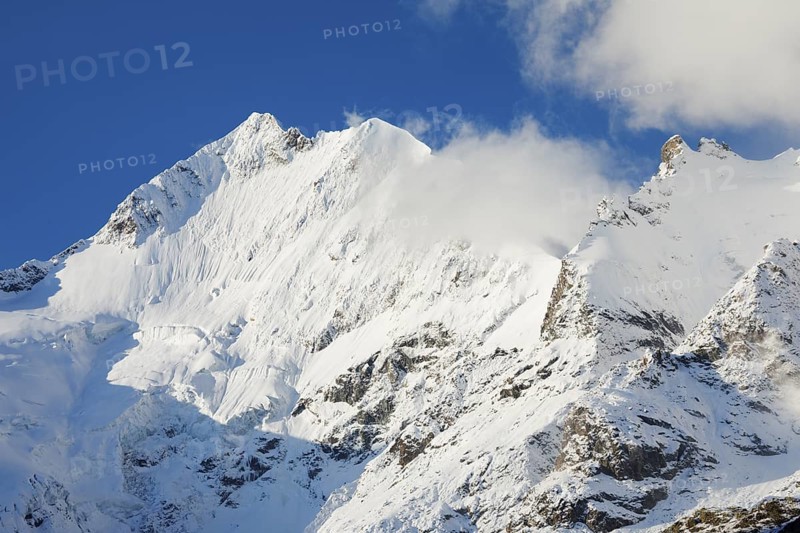 Freshly snow-covered summit of Piz Bernina and Biancograt, Engadin in the canton of Graubünden, Switzerland