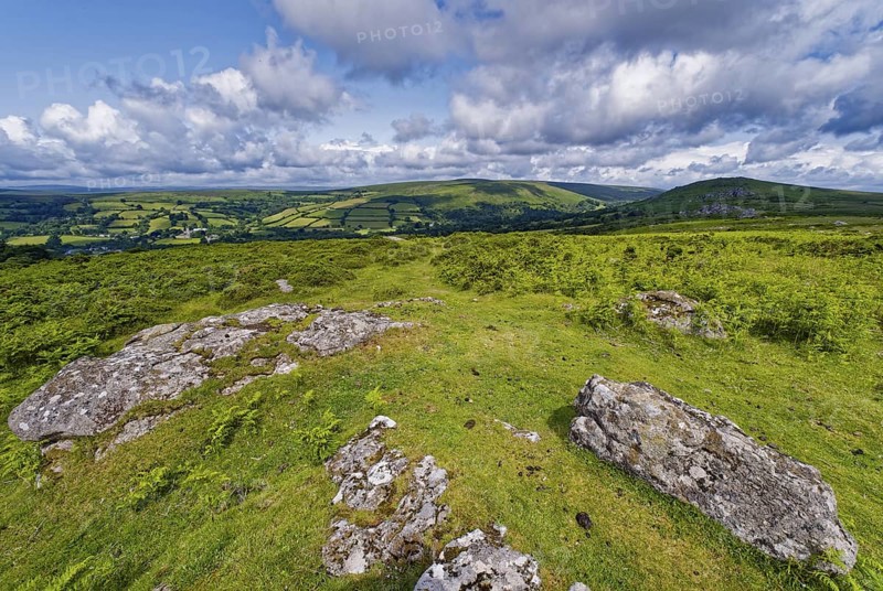 Stones and landscape at the top Tor tor rock hill in Dartmoor National Park. Widecombe-in-the-Moor, Bovey Tracey, Devon, South England, Great Britain