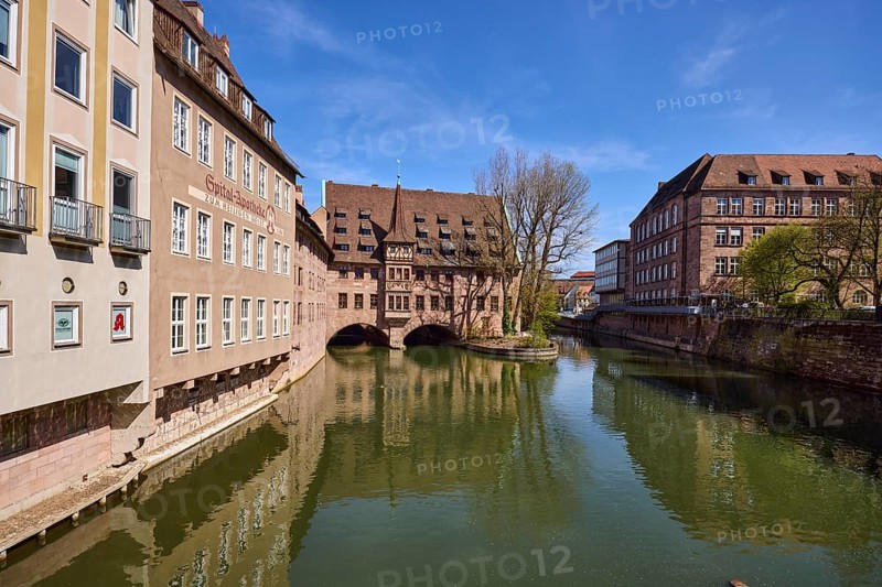 Heilig-Geist-Spital, historical building, river Pegnitz, facade, windows, trees, symmetrical reflections, water surface, blue sky, cirrostratus clouds, Pfarrgasse, Nuremberg, Middle Franconia, independent city, Bavaria, Germany