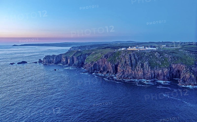 Land's End, landscape and hotel on the Atlantic, at dusk. Land's End, the tip of the headland in the west of Cornwall, is the most westerly point in England. Land's End, Sennen, Penzance, Cornwall, South West England, Great Britain