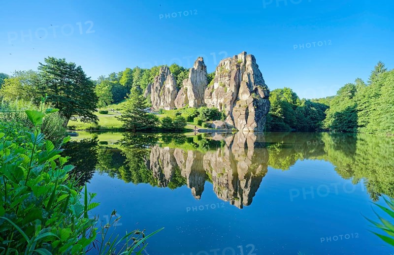 The Externsteine, a sandstone rock formation around 40 metres high in the Teutoburg Forest, are a natural landmark and a protected natural and cultural monument. They are regarded as a place of power and are said to have special cultural and historical significance. The rocks are located by the Wiembecketeich pond. Horn-Meinberg, North Rhine-Westphalia, Germany